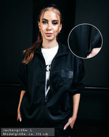 SAEBIS® Damen Oversized Trainingsjacke schwarz mit SAEBIS® Patch