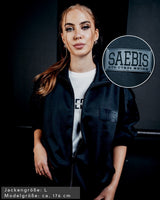 SAEBIS® Damen Oversized Trainingsjacke schwarz mit SAEBIS® Patch